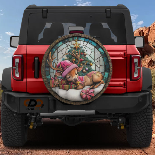 a red Jeep Wrangler with a large, colorful, and whimsical Christmas-themed spare tire mounted on the rear of the vehicle.