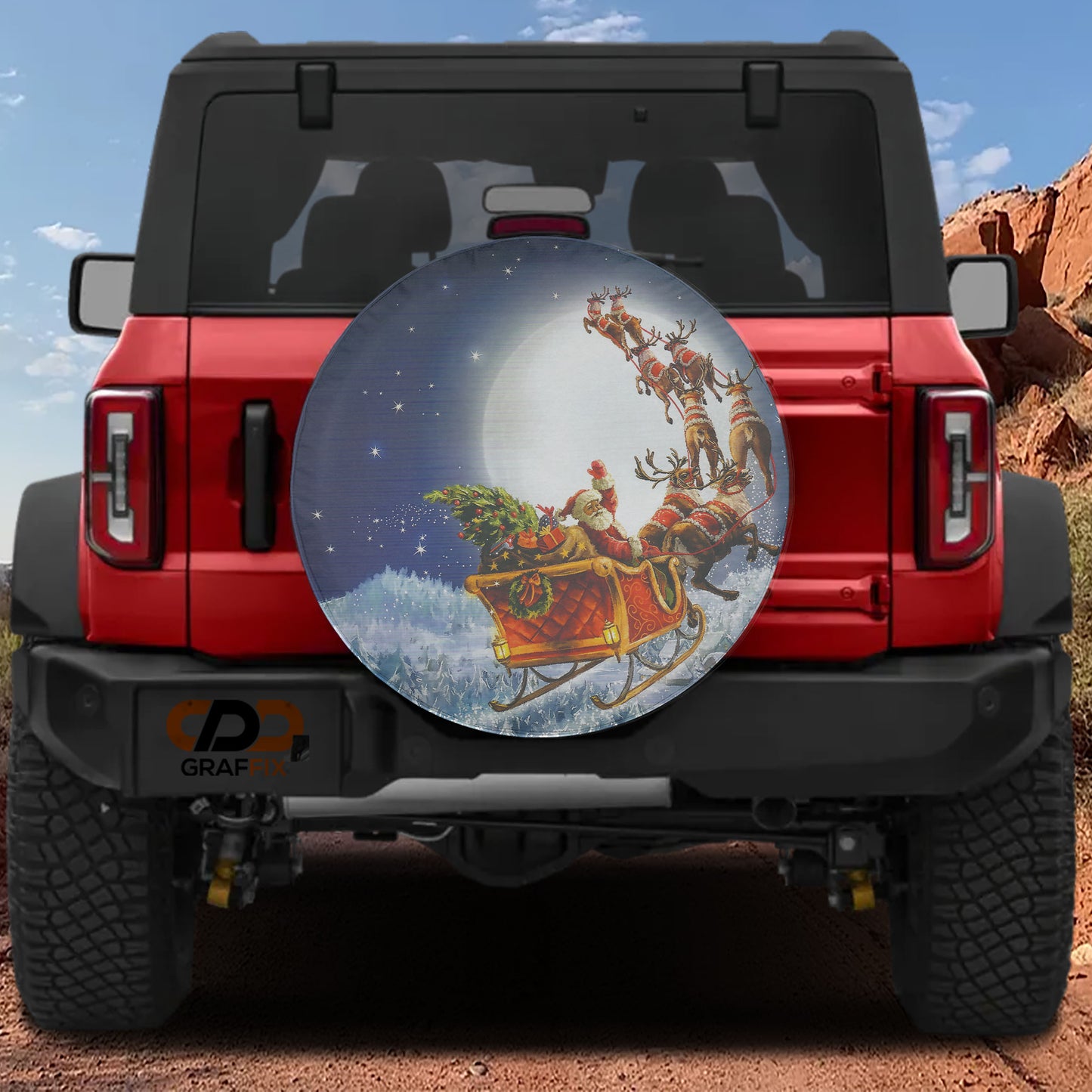 A red Jeep Wrangler with a large Christmas-themed spare tire on the rear.