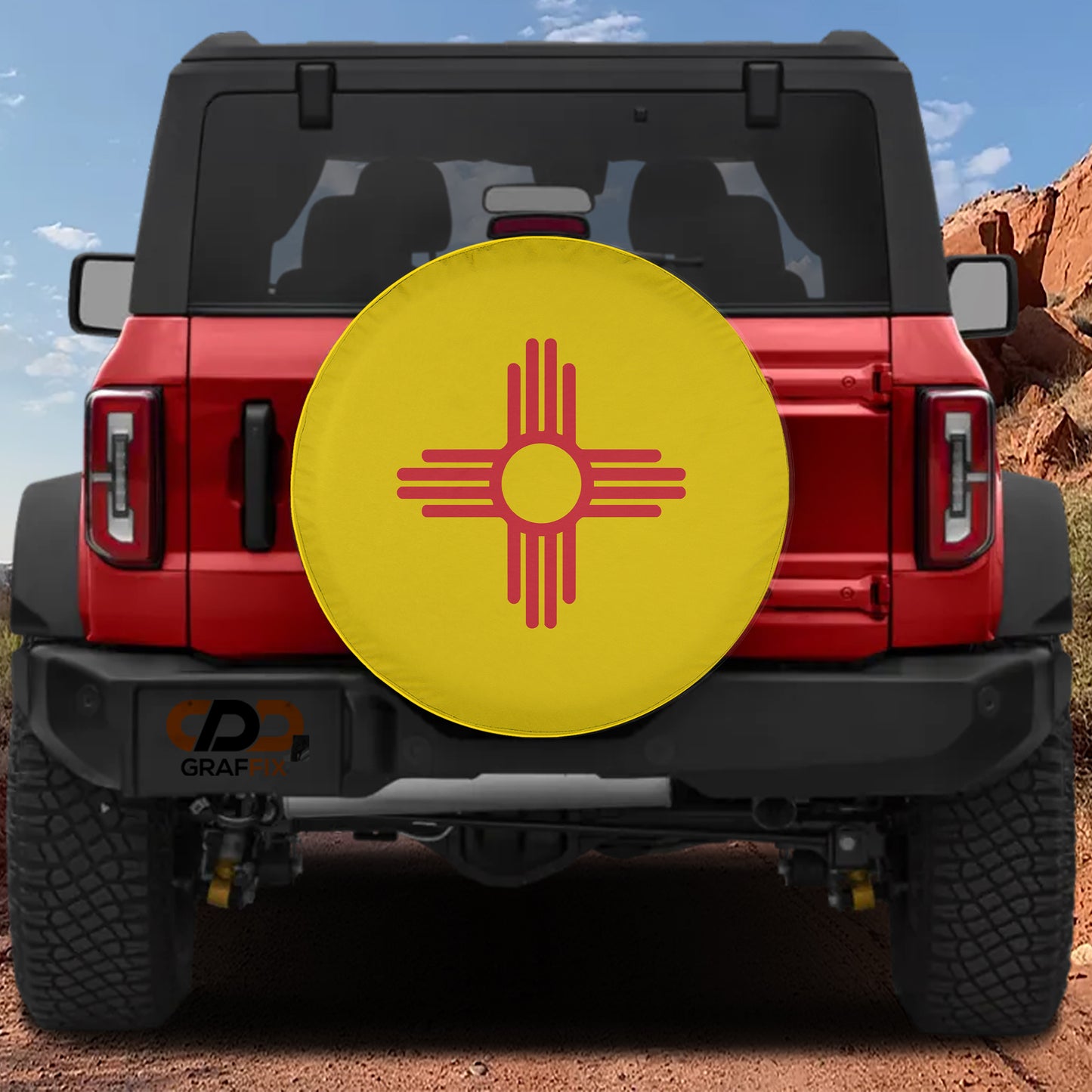 A red Jeep Wrangler with a large yellow and red symbol on the rear bumper.