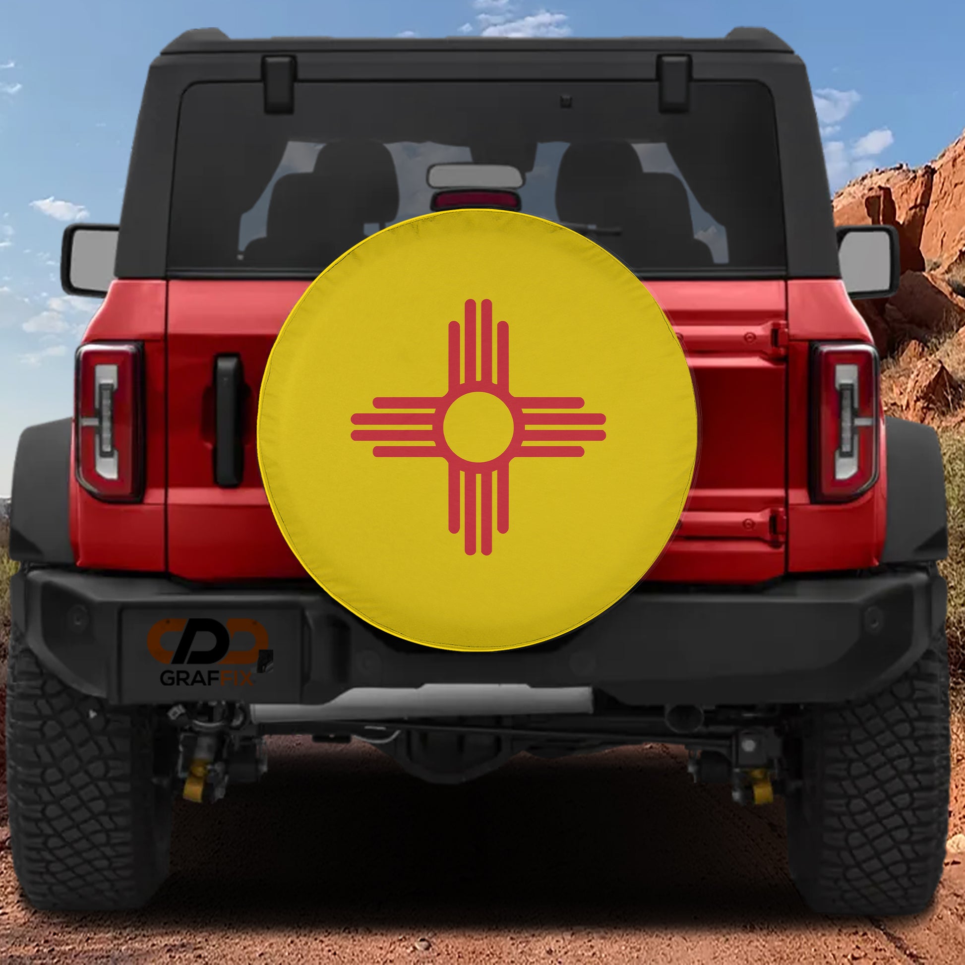 A red Jeep Wrangler with a large yellow and red symbol on the rear bumper.