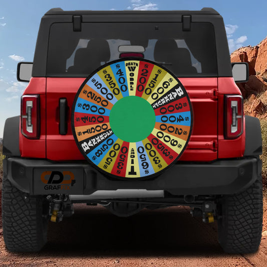 a red Jeep Wrangler with a large, colorful wheel cover on the rear of the vehicle.