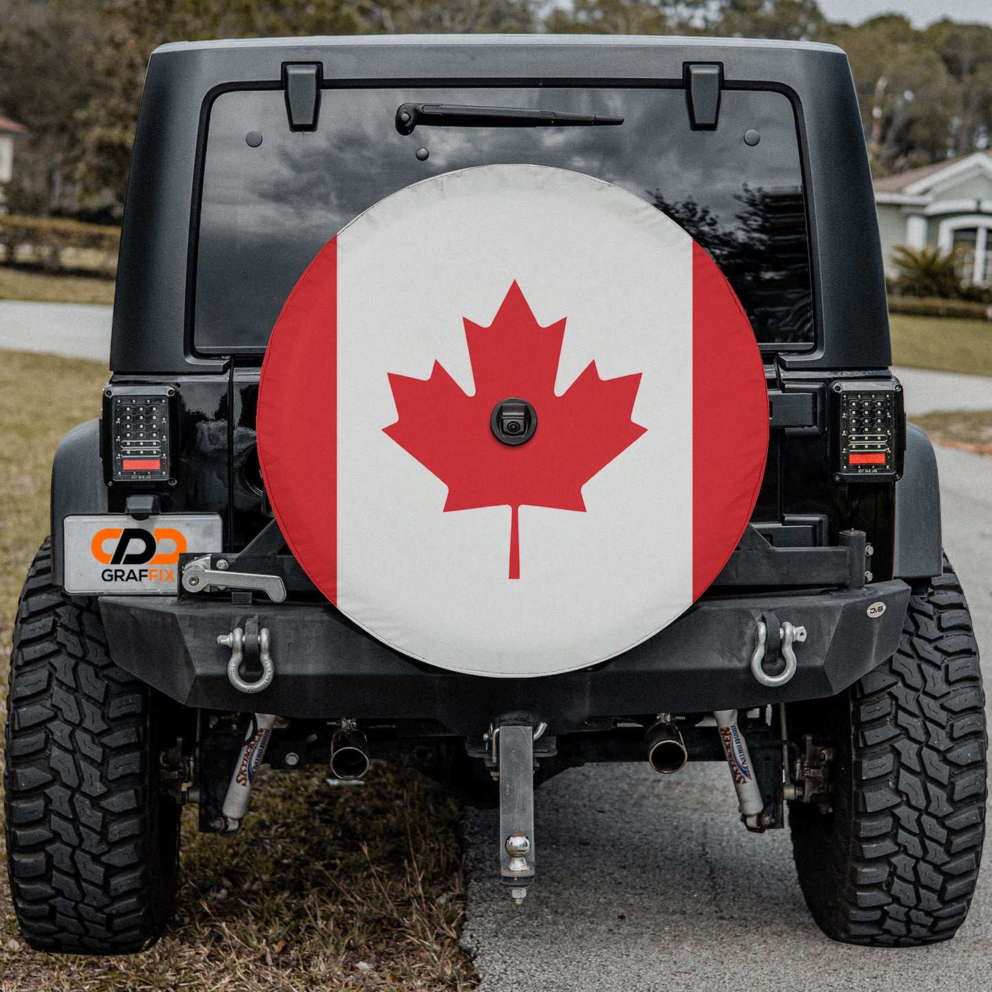 a canadian flag on the back of a jeep