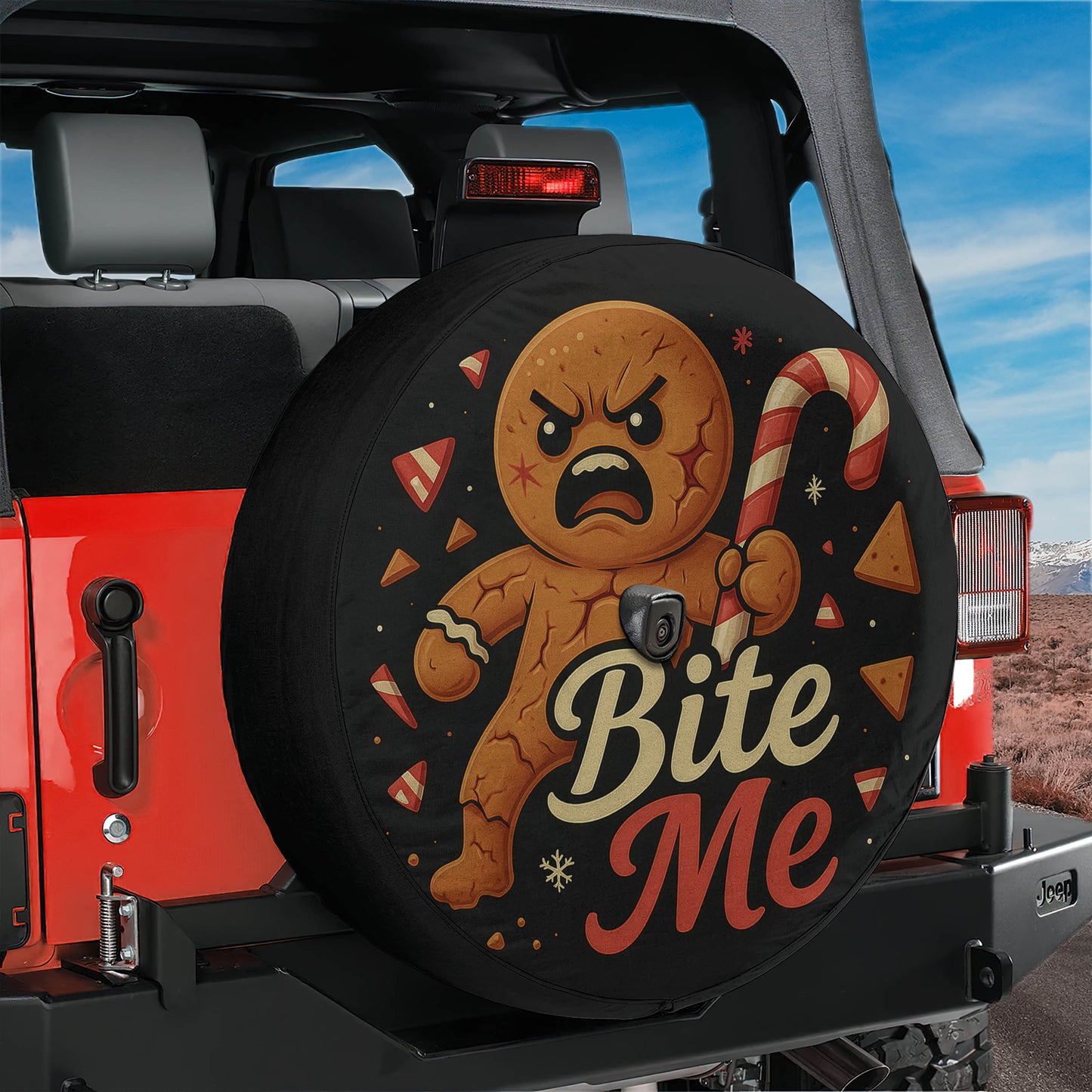 A red Jeep with a tire cover featuring a cartoon character and the text "Bite Me".