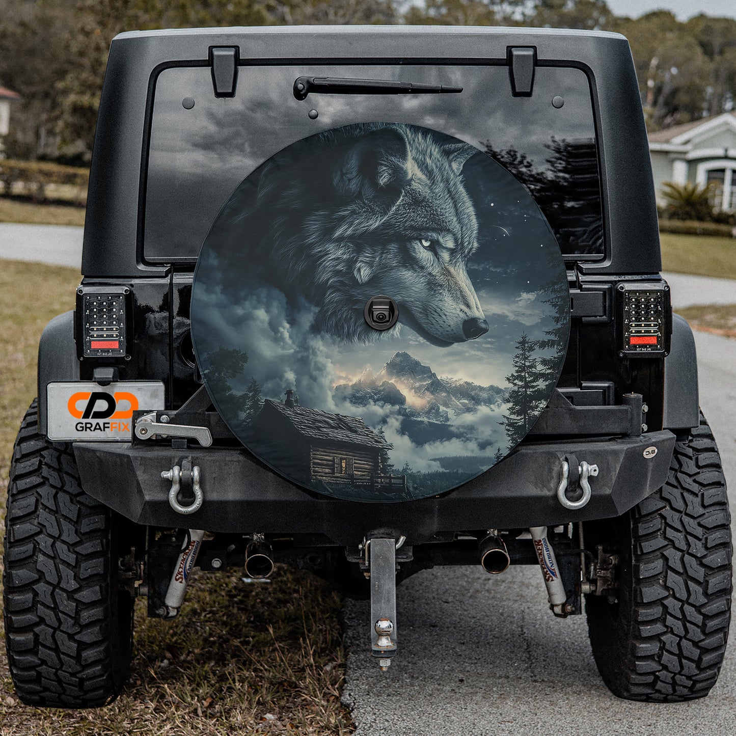 a large, detailed sticker of a wolf's head on the rear window of a vehicle.
