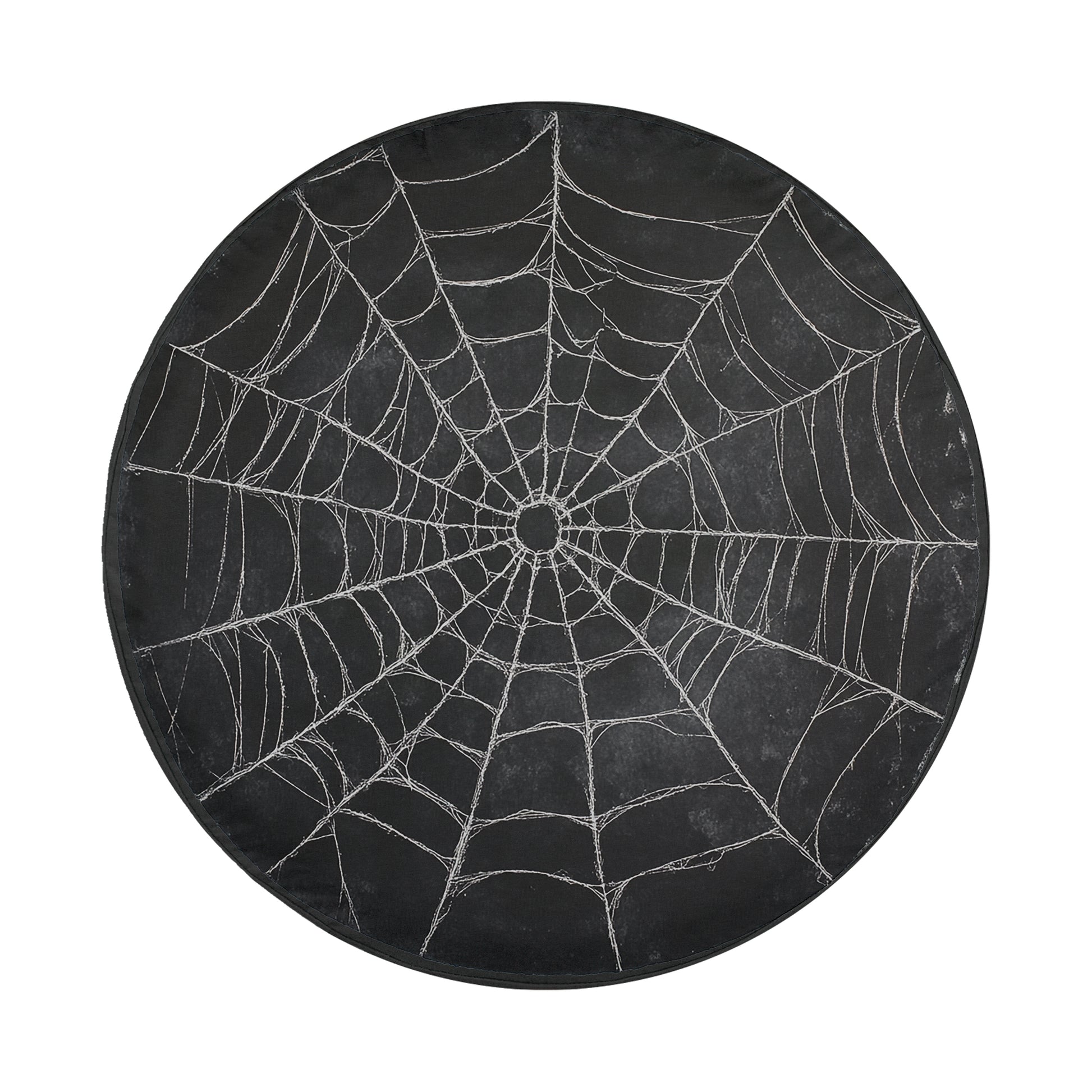 A black spider web with intricate patterns and a central hub is displayed in the image.
