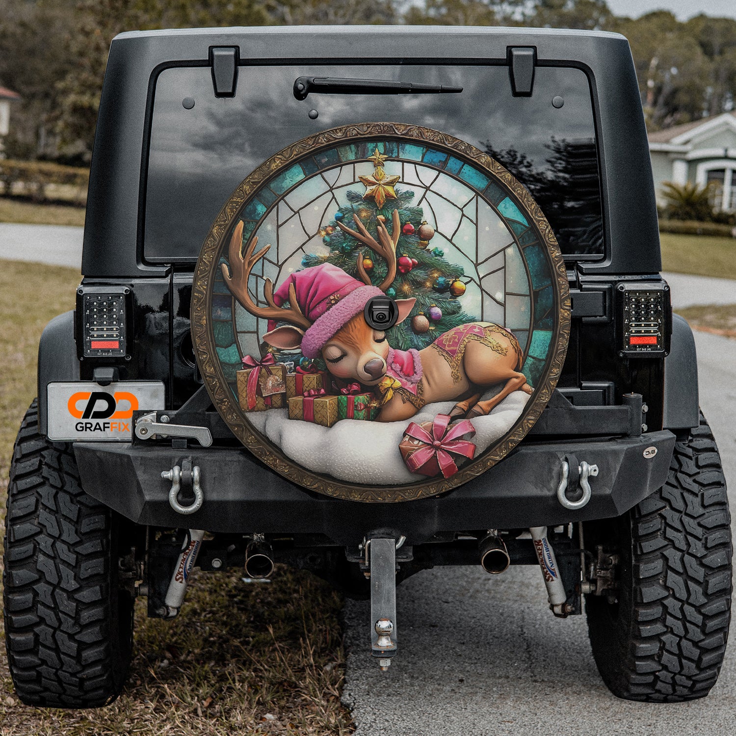 a decorated jeep with a deer and a christmas tree