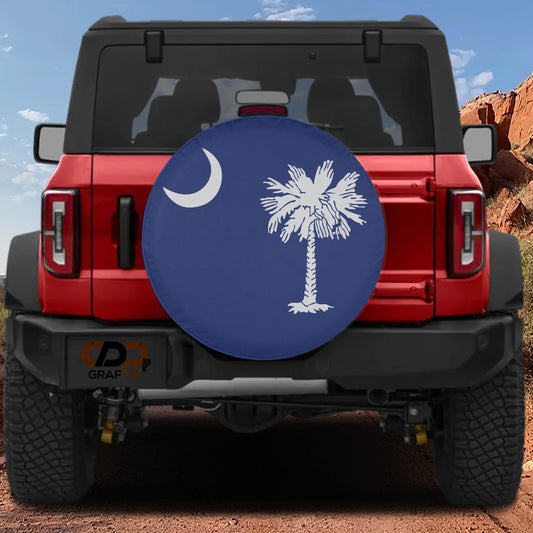 the back of a red Jeep Wrangler with a blue and white tire cover featuring a palm tree and a crescent moon.