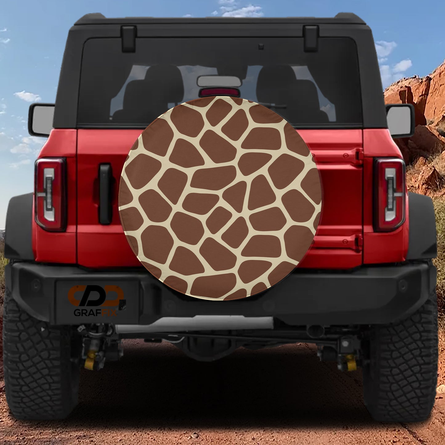 the rear view of a red Jeep Wrangler with a giraffe-patterned spare tire mounted on the vehicle.