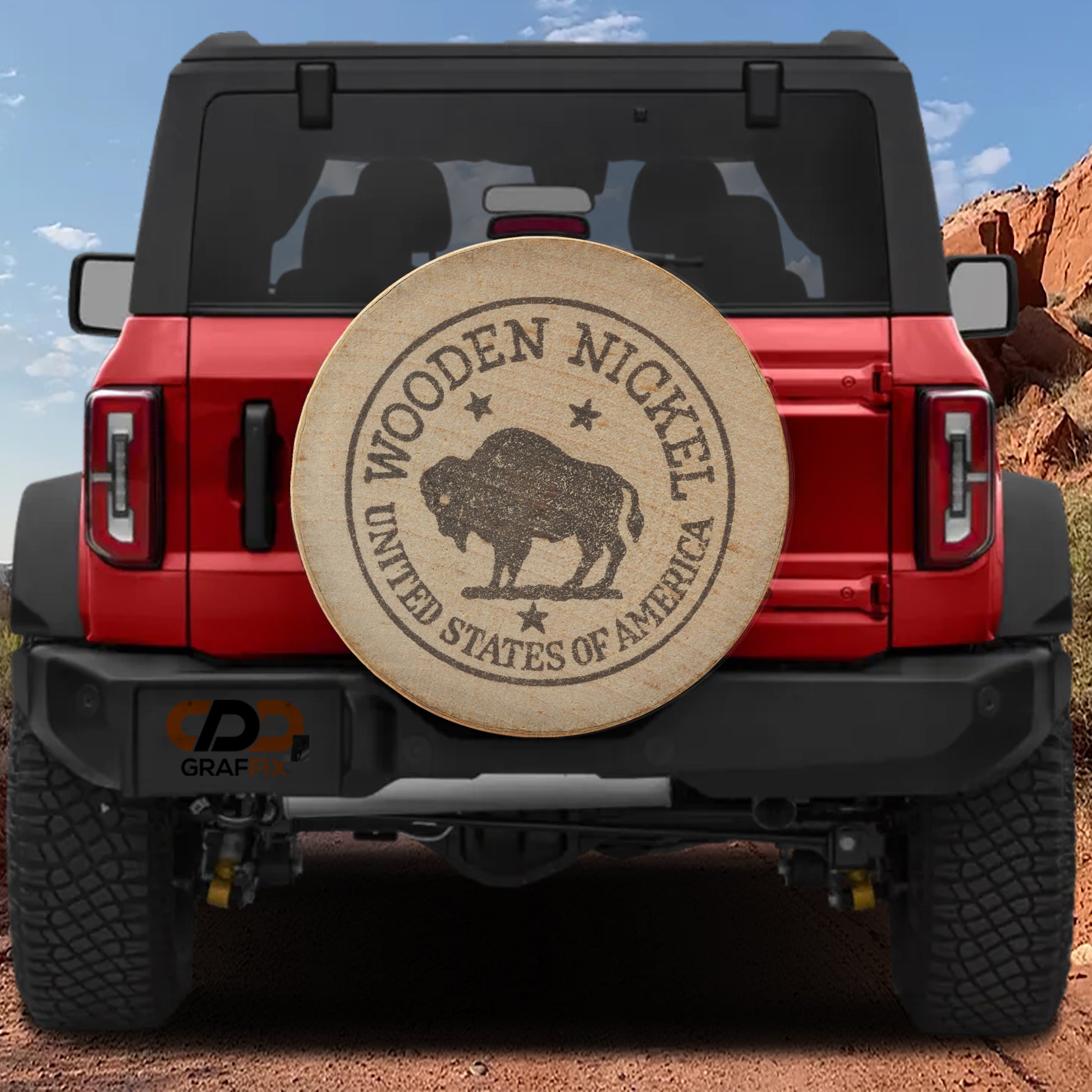 a red Jeep Wrangler with a wooden spare tire attached to the rear.