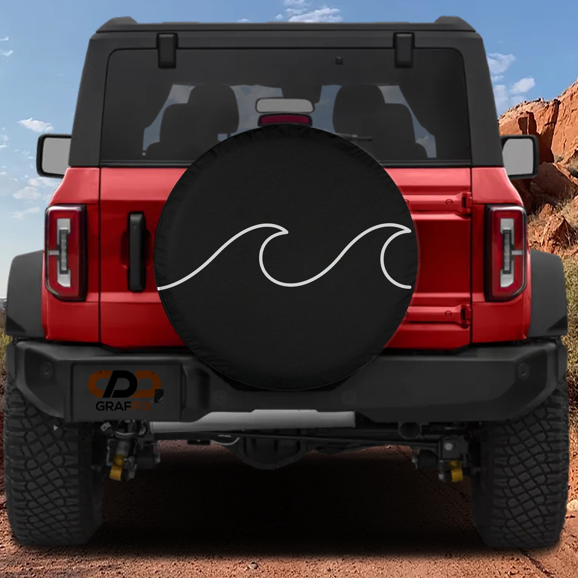 A red Jeep Wrangler with a black tire cover featuring a white wave design.