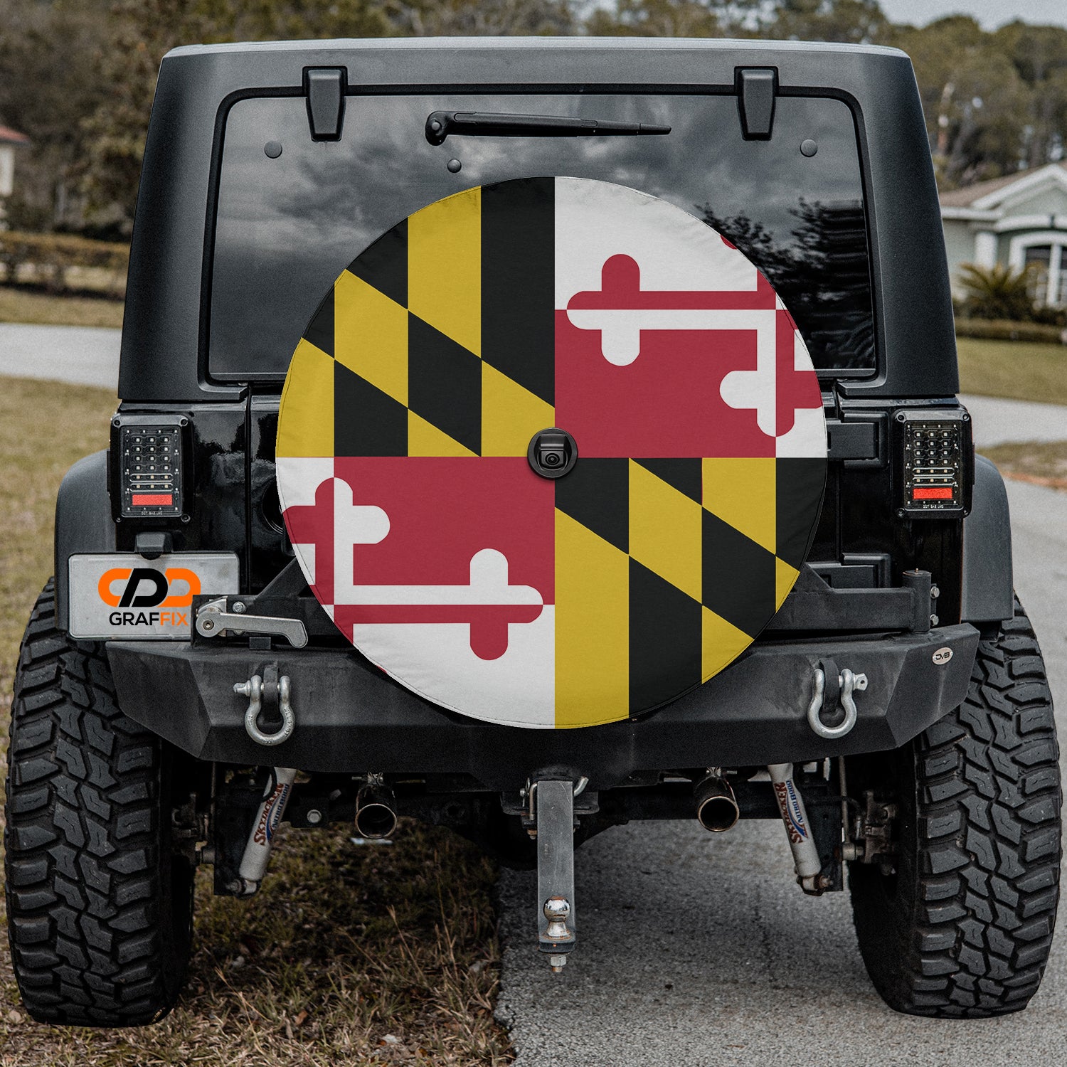 a black jeep with a red, yellow, and black flag on it
