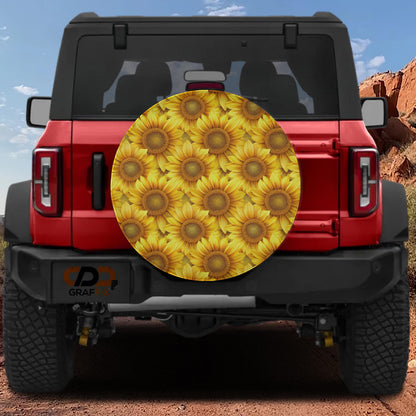 the rear of a red Jeep Wrangler with a large sunflower-patterned spare tire attached to the vehicle.