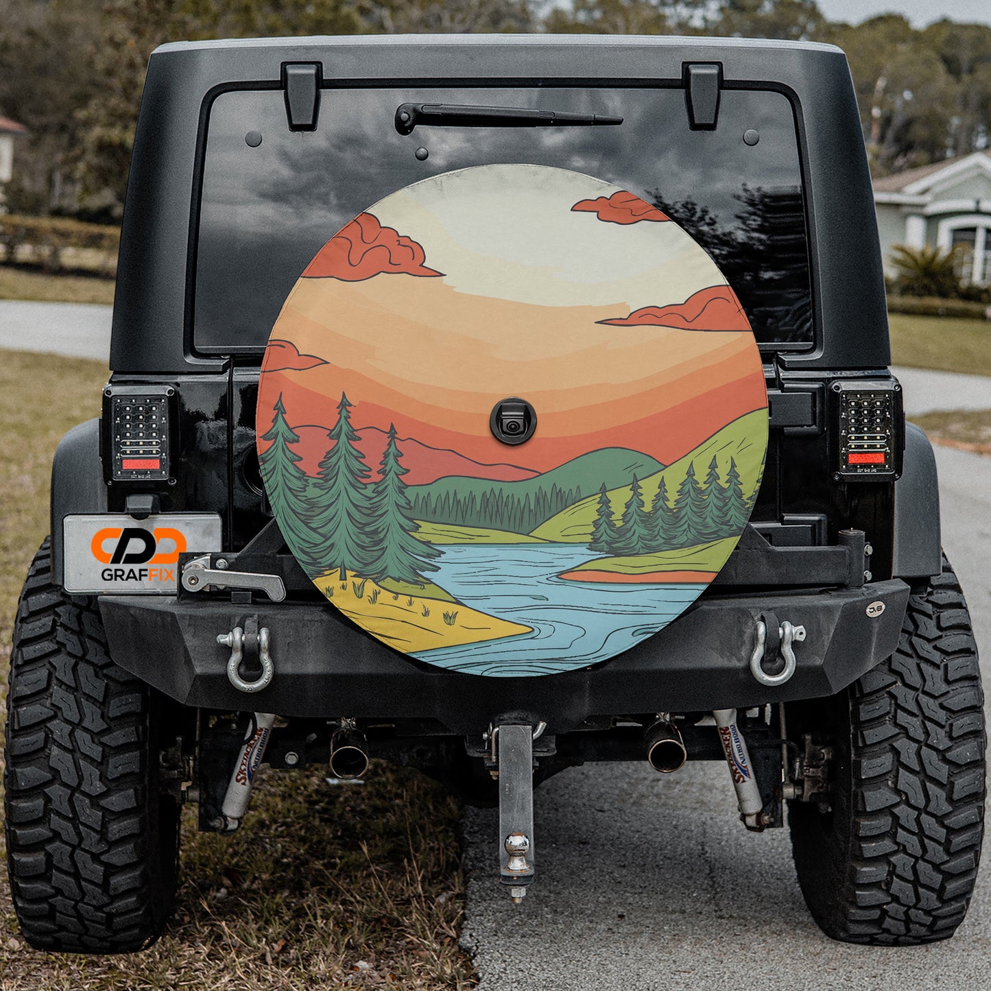 a jeep with a painted tire cover on it