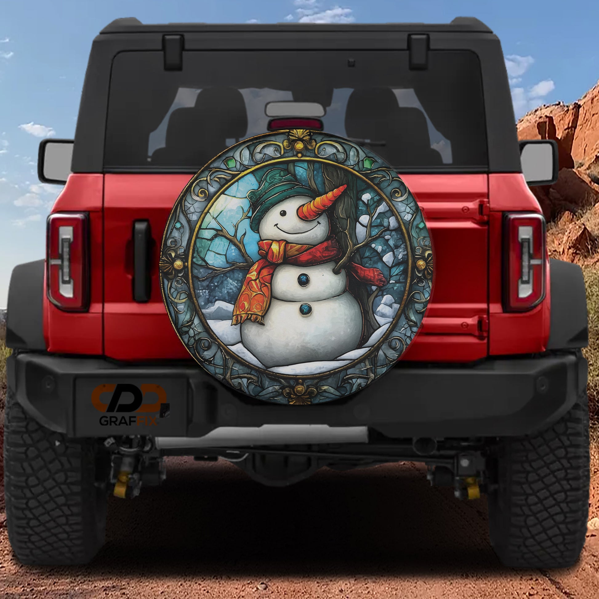 A red Jeep Wrangler with a snowman decal on the rear window.