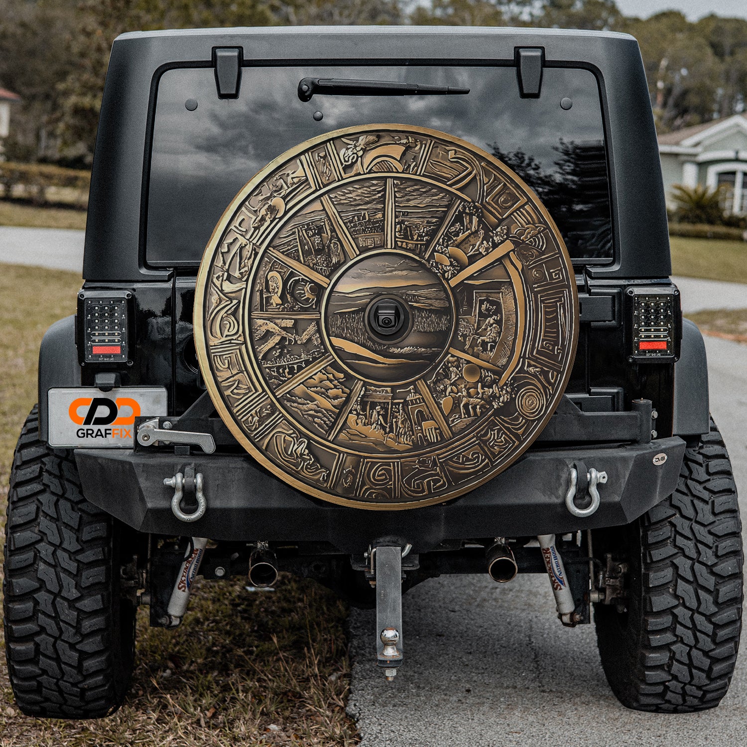 a black jeep with a gold sun symbol on it
