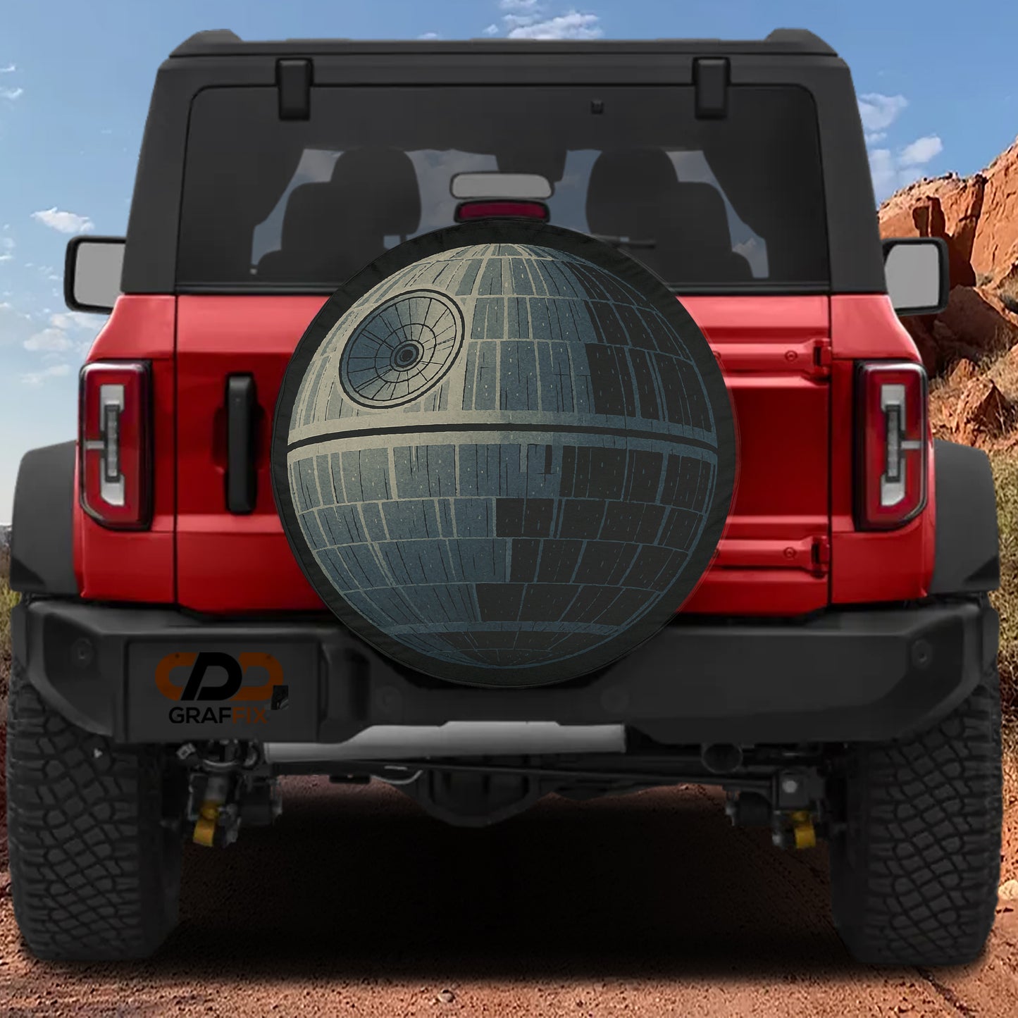 A red Jeep Wrangler with a large Star Wars Death Star decal on the rear window.