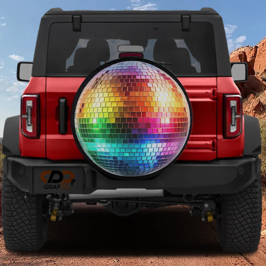 A red Jeep Wrangler with a disco ball mounted on the rear.