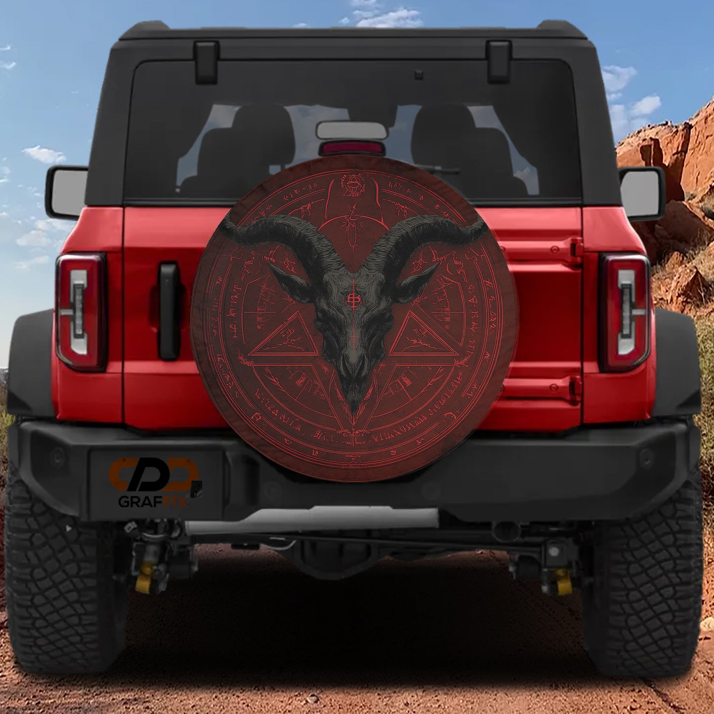 a red Jeep Wrangler with a large, circular spare tire cover on the rear of the vehicle.