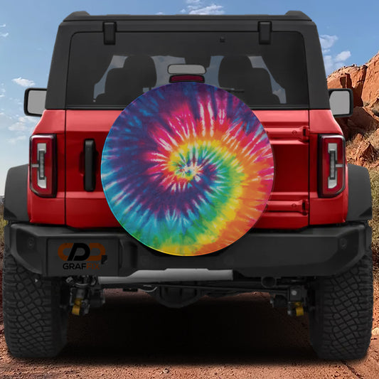 a red jeep with a colorful tie - dyed wheel cover
