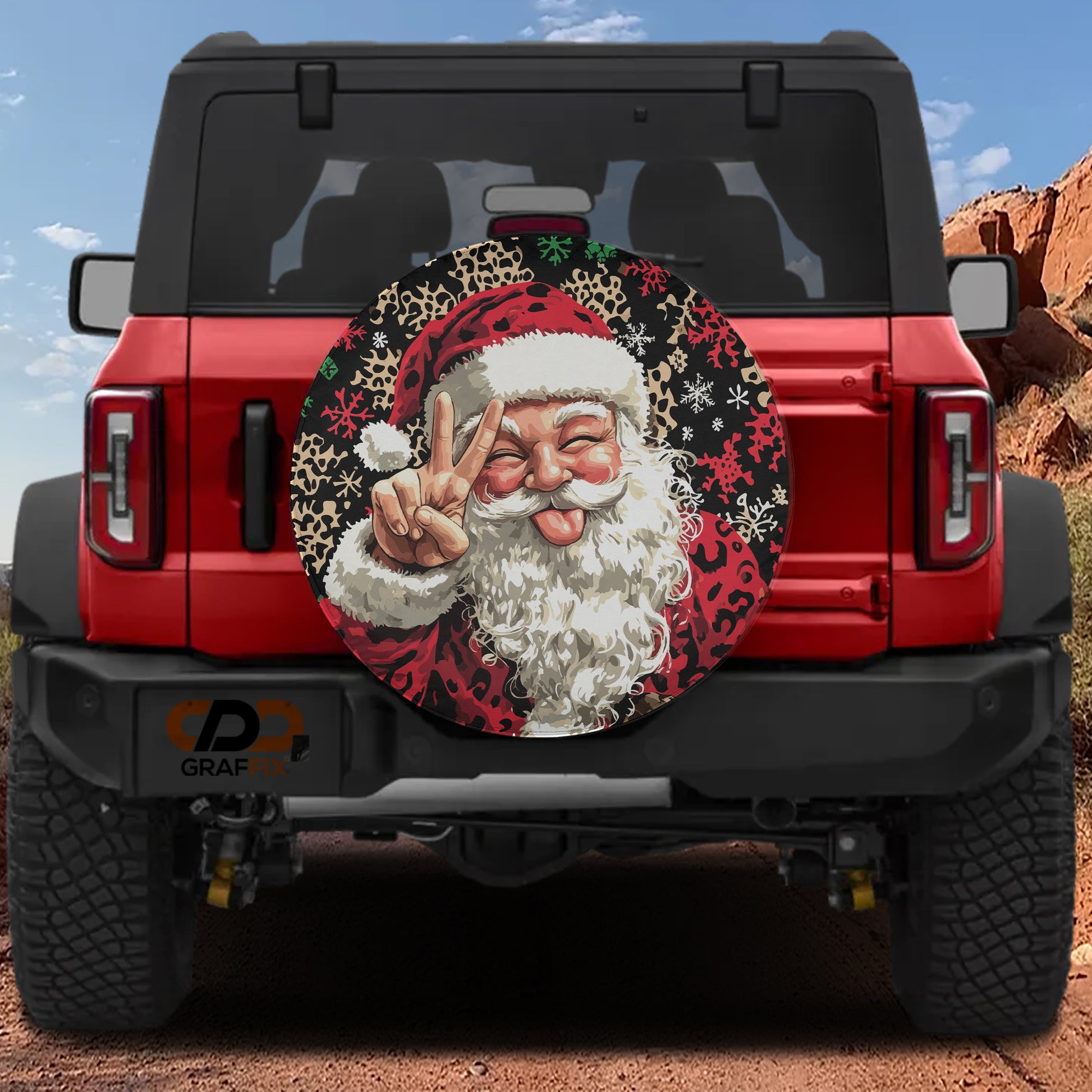 A red Jeep Wrangler with a large, colorful Santa Claus decal on the rear window.
