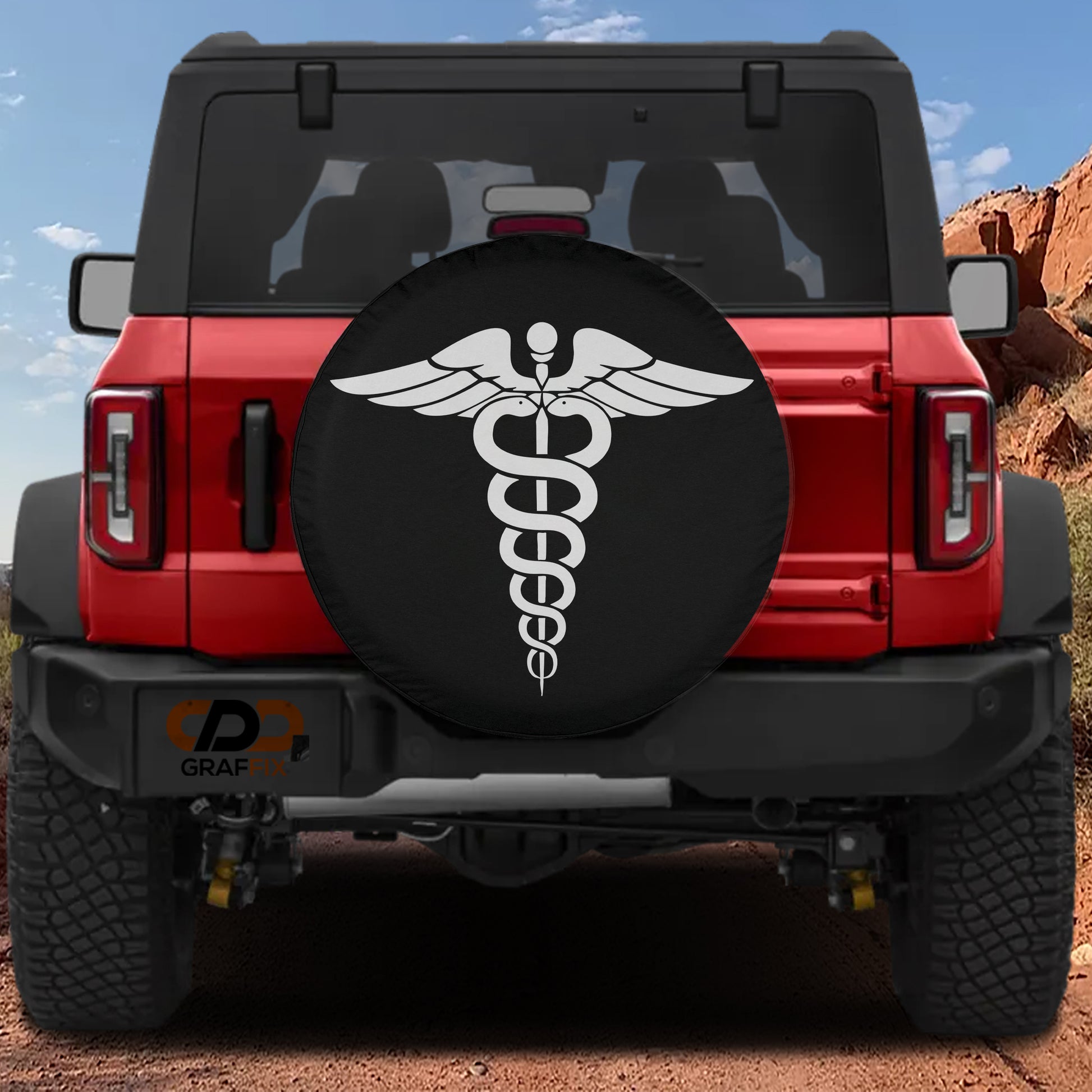 the back of a red Jeep Wrangler with a black tire cover featuring a white medical symbol, likely a caduceus, on the rear wheel.