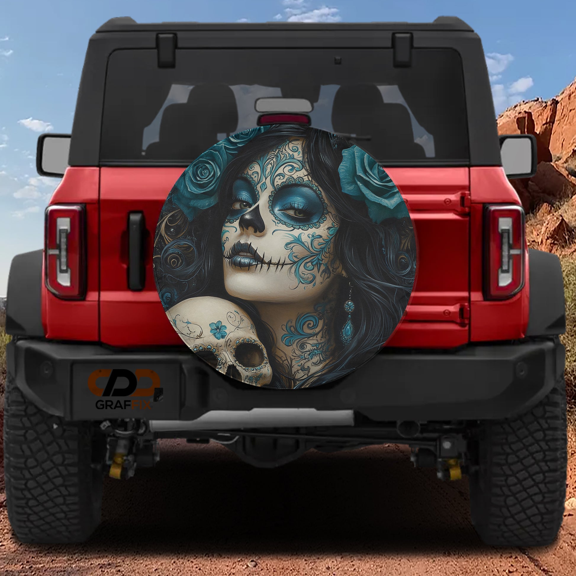 a red Jeep Wrangler with a large skull and floral design on the rear window.
