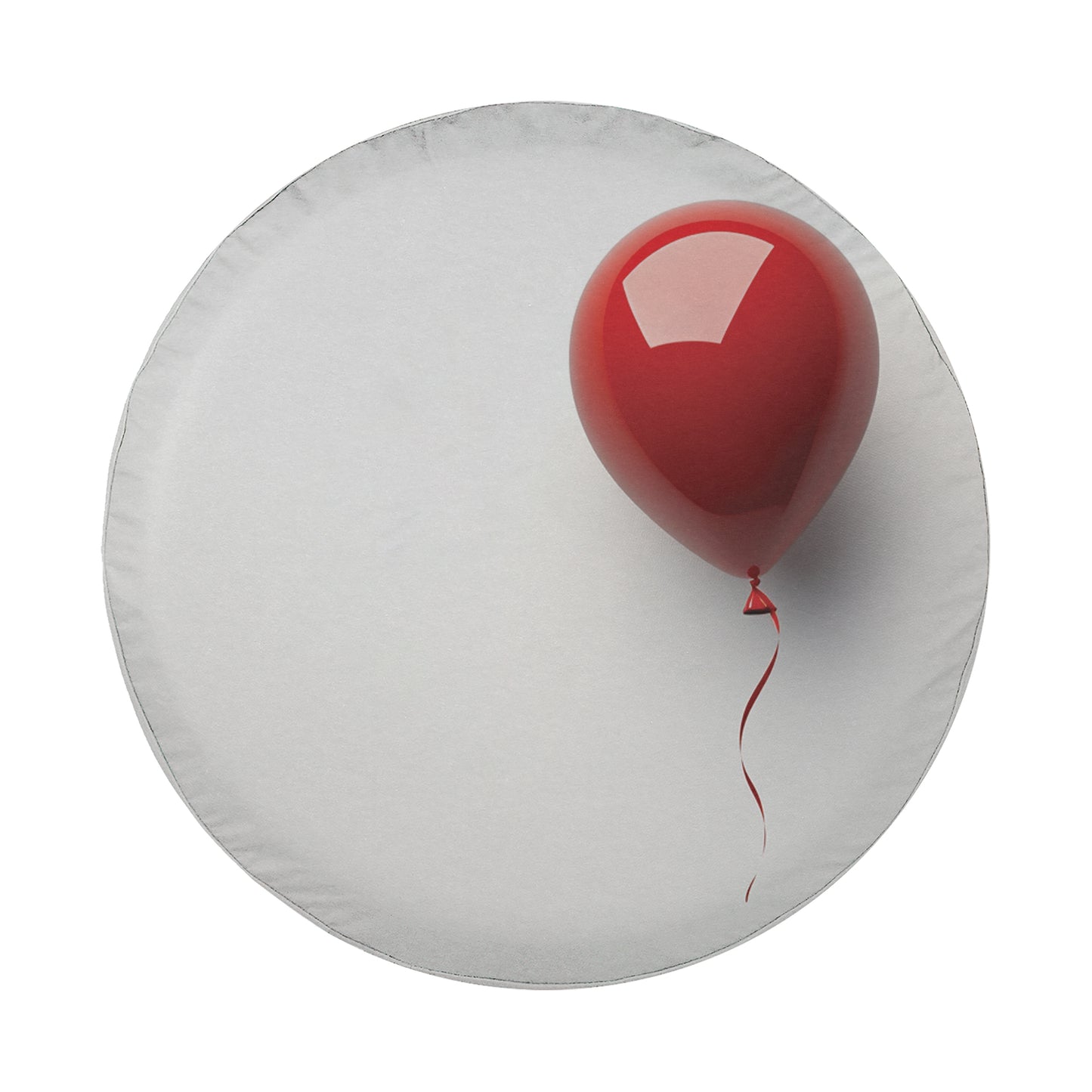 A red balloon is floating on a white surface, with a white circle in the background.