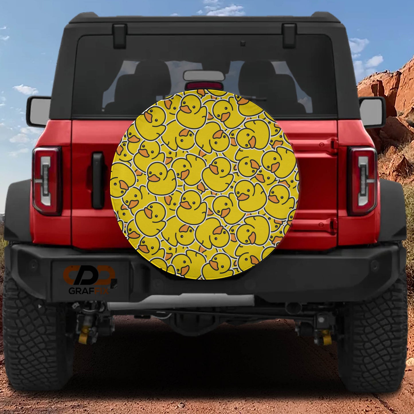 the back of a red Jeep Wrangler with a large yellow duck decal on the rear window.