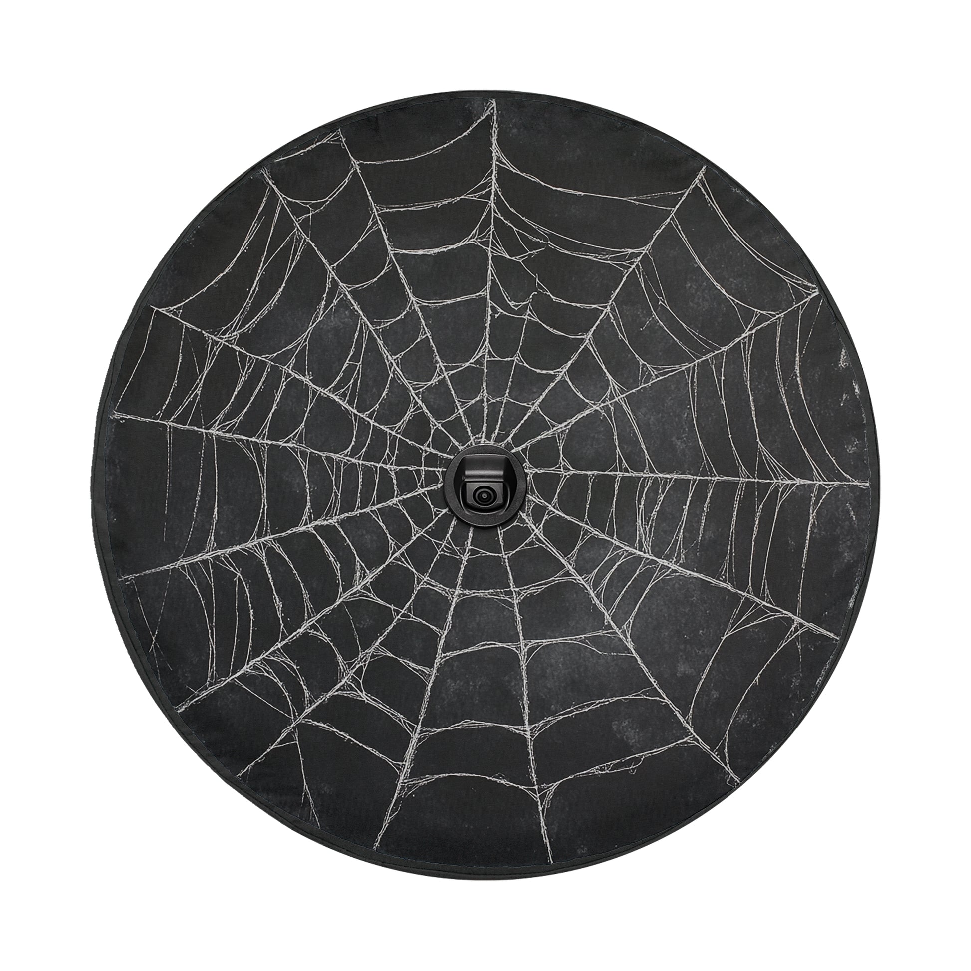a black spider web with intricate patterns and a small camera placed in the center of the web.
