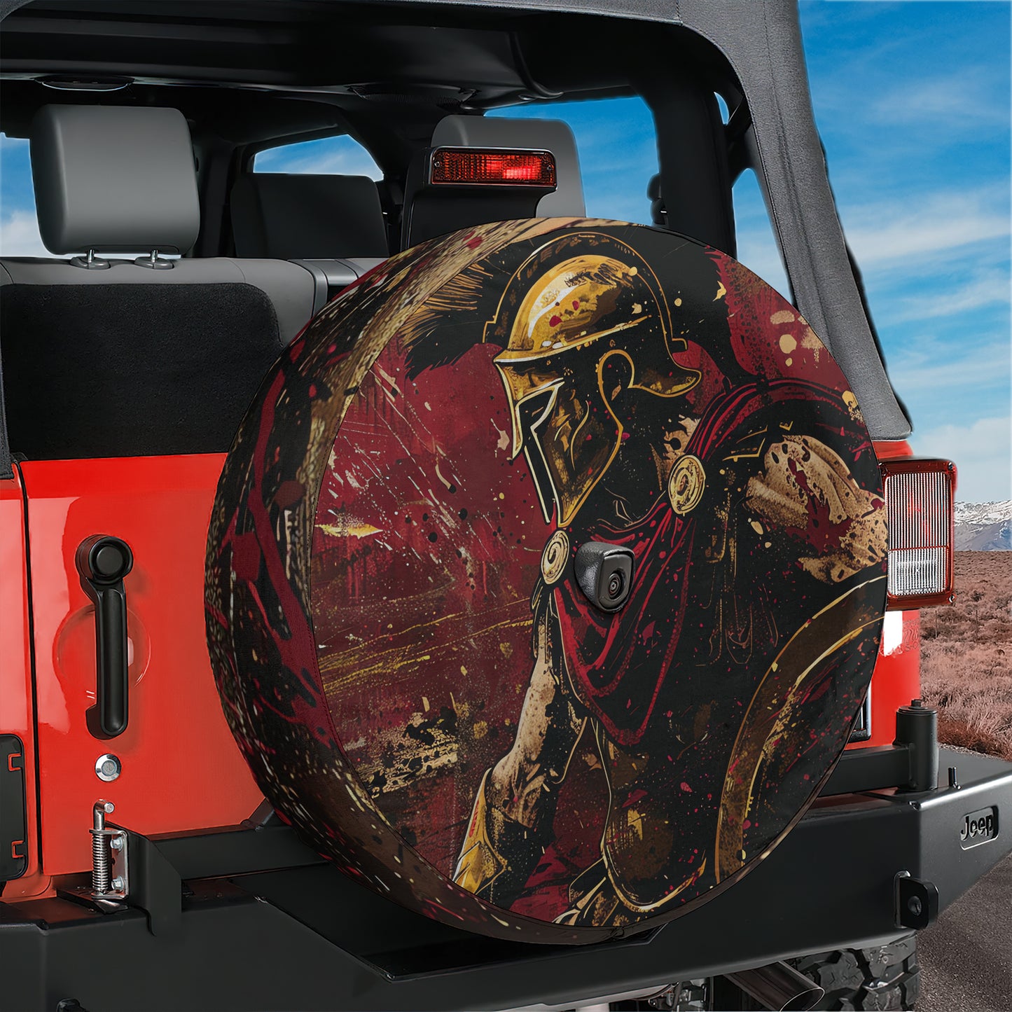 a red Jeep with a large, decorative wheel cover depicting a warrior or soldier in a red and gold color scheme.