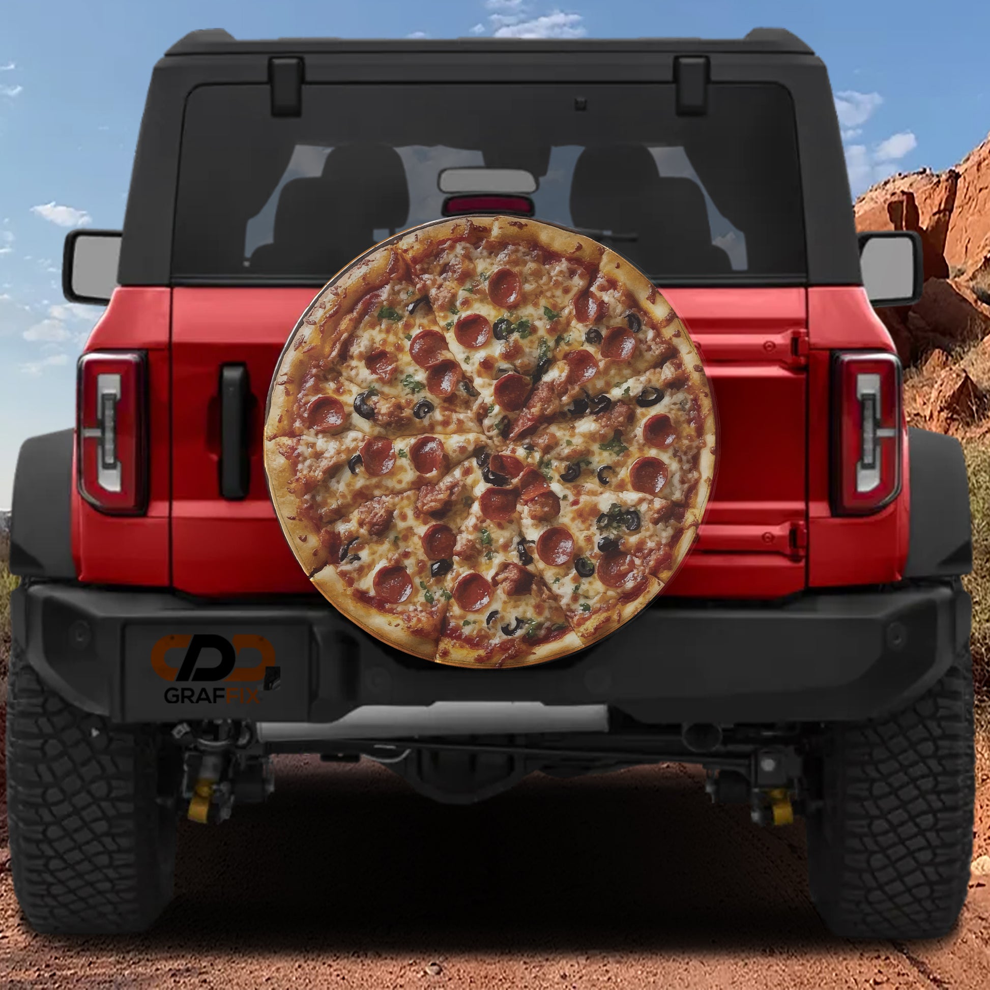 A red Jeep Wrangler with a large pizza decal on the rear window.