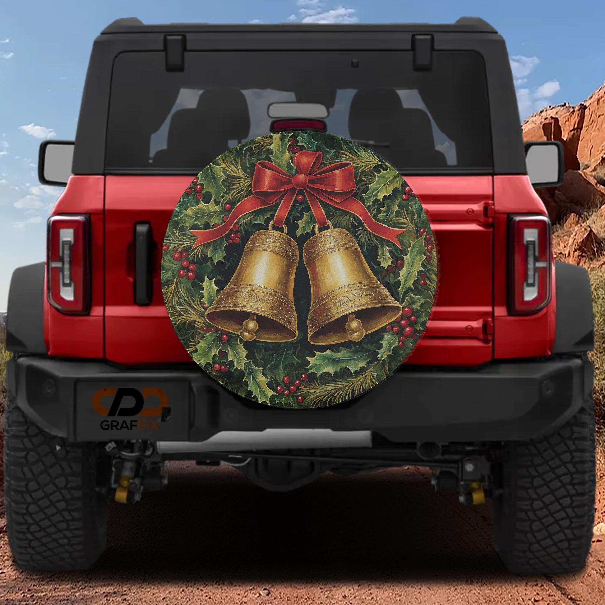 the back of a red Jeep Wrangler with a large Christmas-themed bell decal on the rear window.