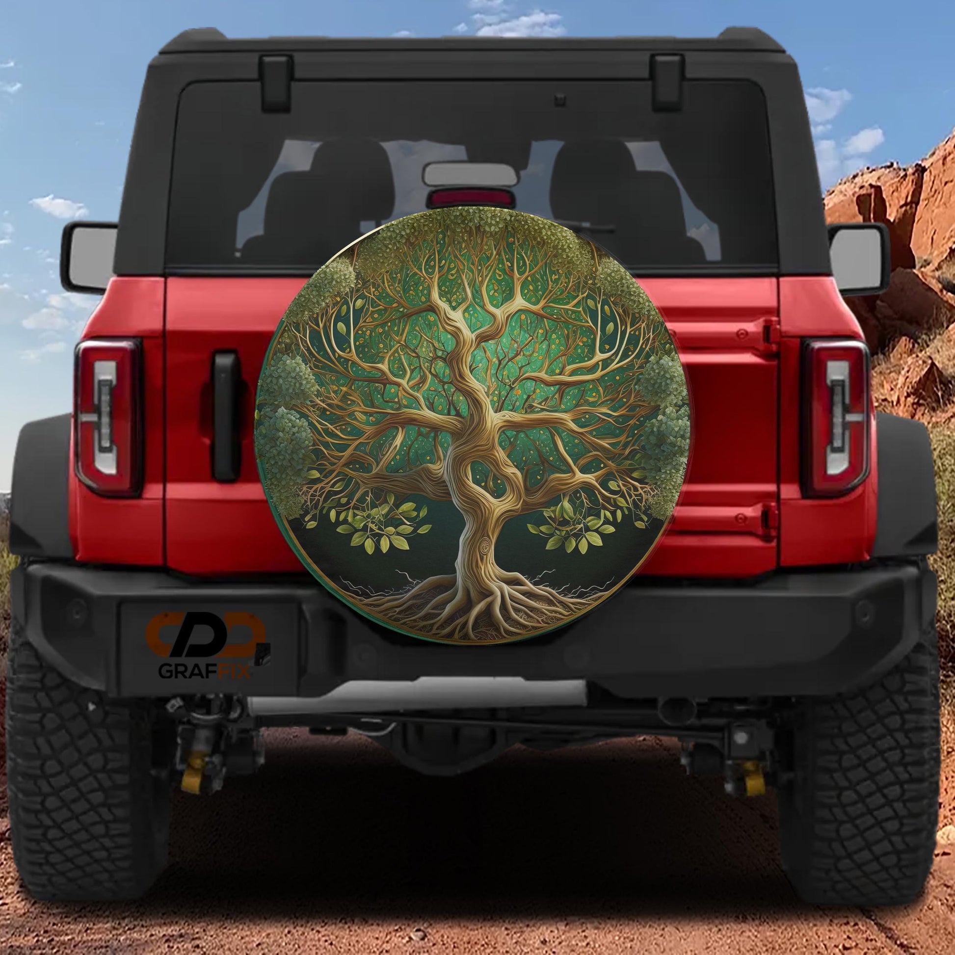the rear view of a red Jeep Wrangler with a large tree-like design on the rear window.