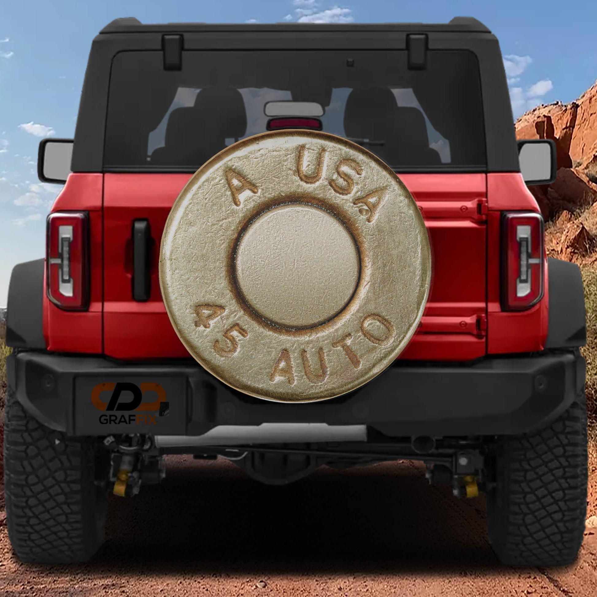a red Jeep Wrangler with a large silver bullet-shaped spare tire attached to the rear of the vehicle.