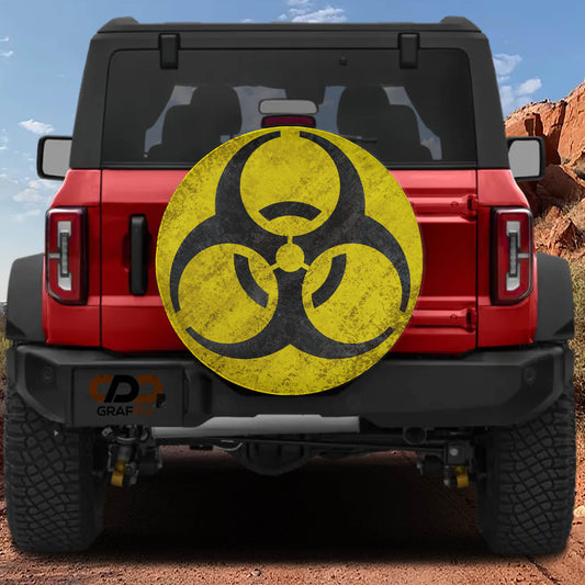 a red Jeep Wrangler with a large, worn-out biohazard symbol on the rear of the vehicle.