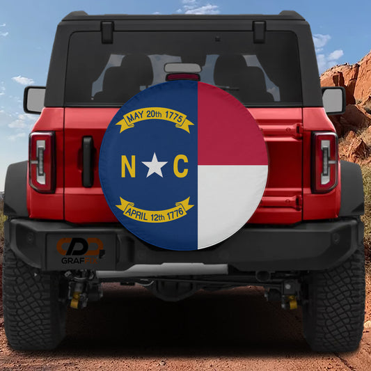 a red Jeep Wrangler with a large round spare tire cover on the rear of the vehicle.