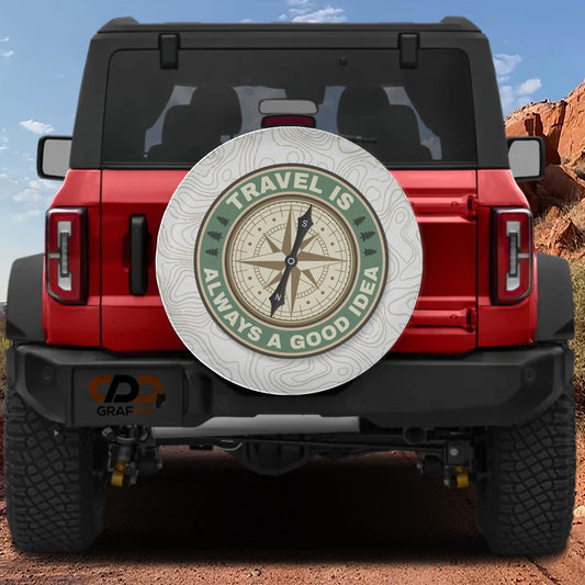 a red Jeep Wrangler with a compass-themed spare tire cover on the rear of the vehicle.