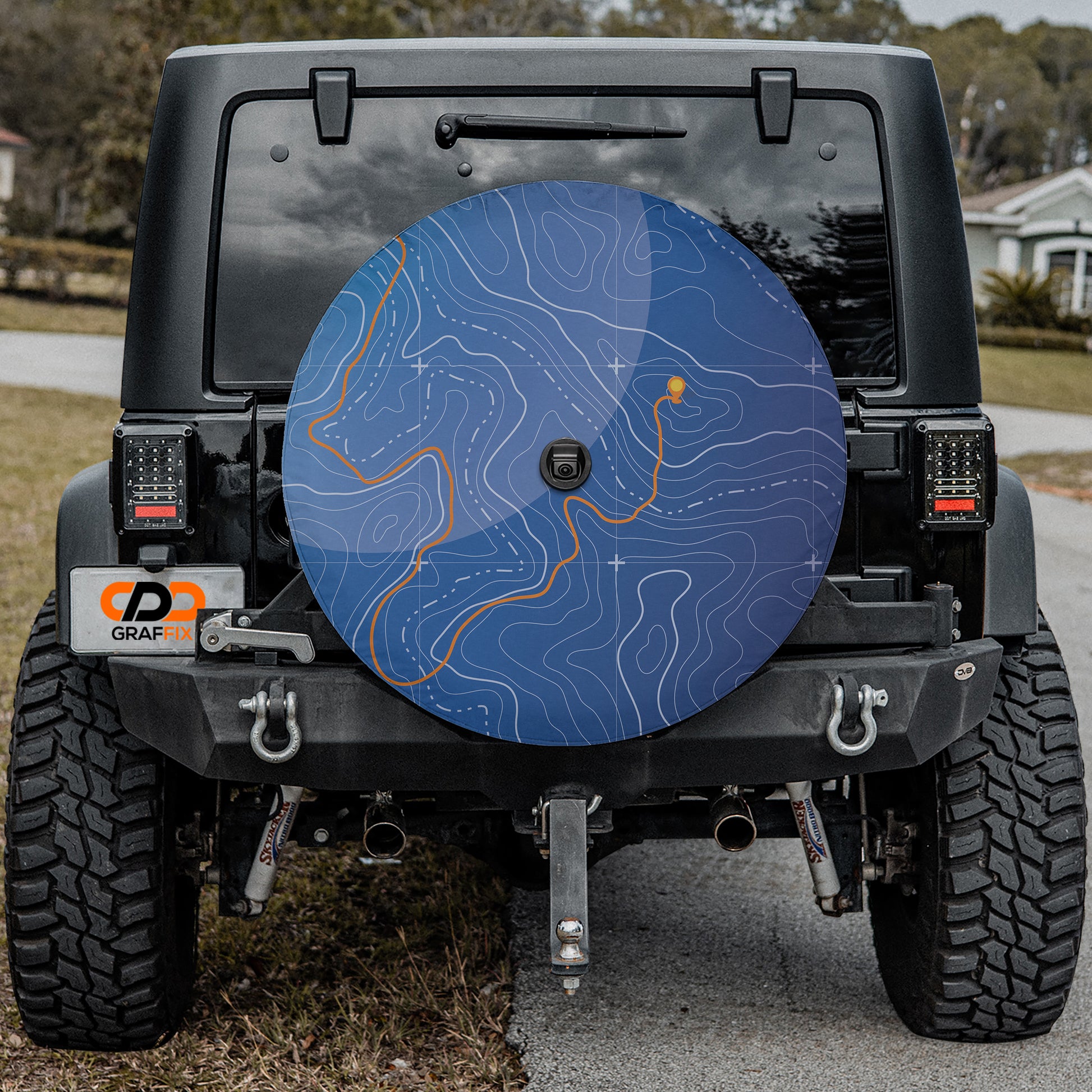 a blue disc is on the back of a black jeep