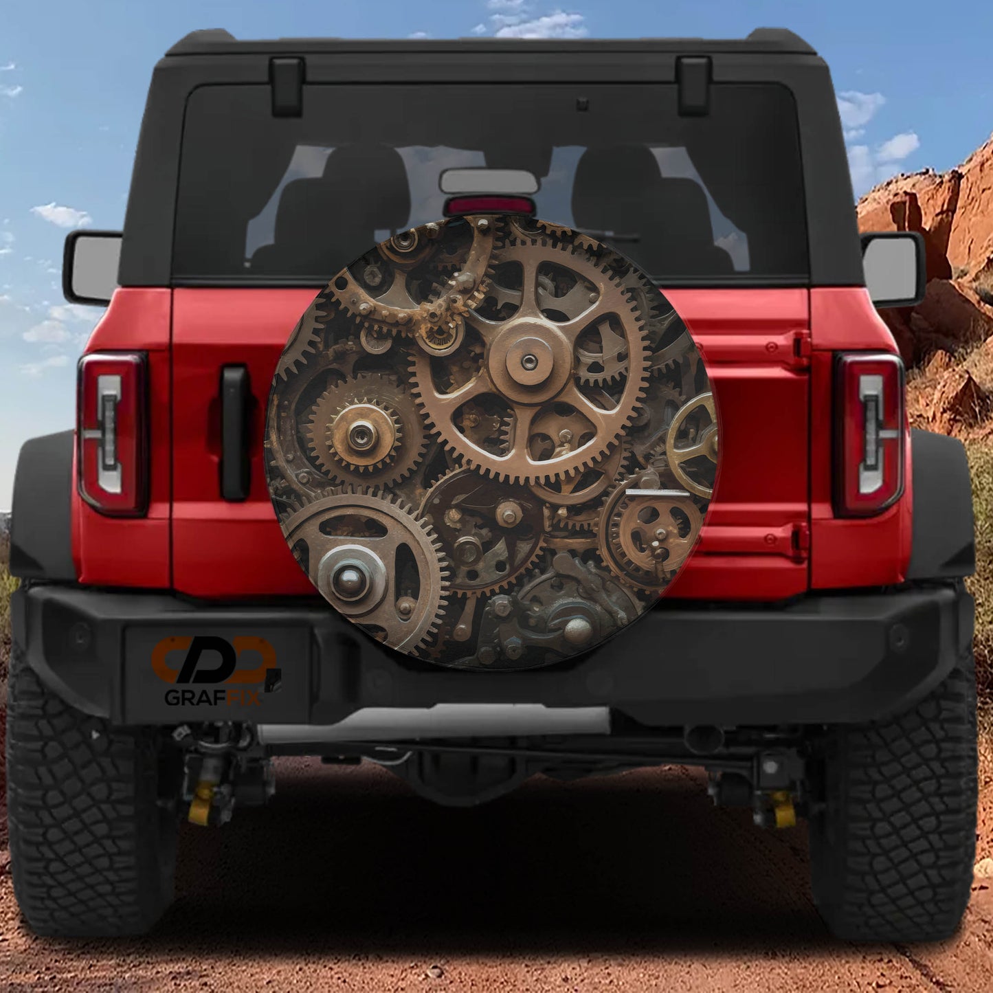 a red Jeep Wrangler with a large gear-shaped spare tire mounted on the rear of the vehicle.