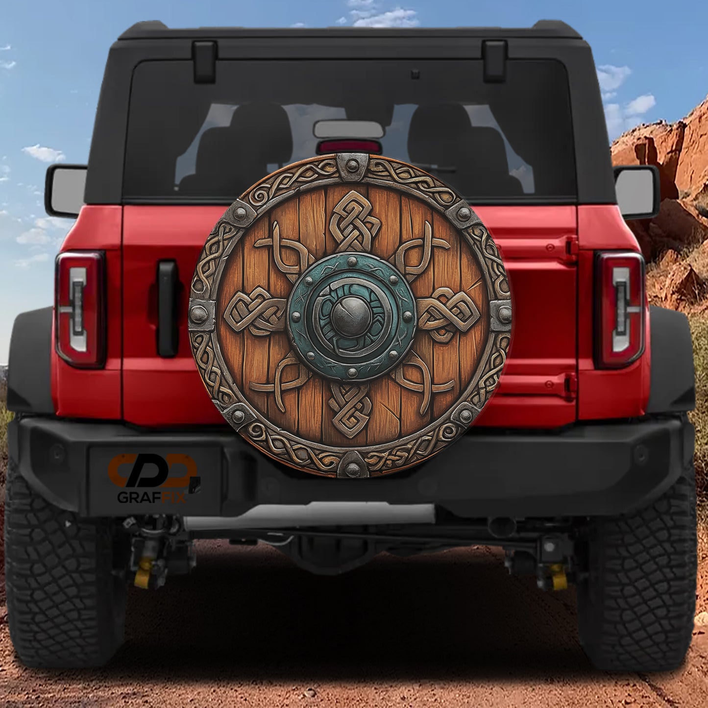 a red Jeep Wrangler with a large wooden shield-like object on the rear of the vehicle.