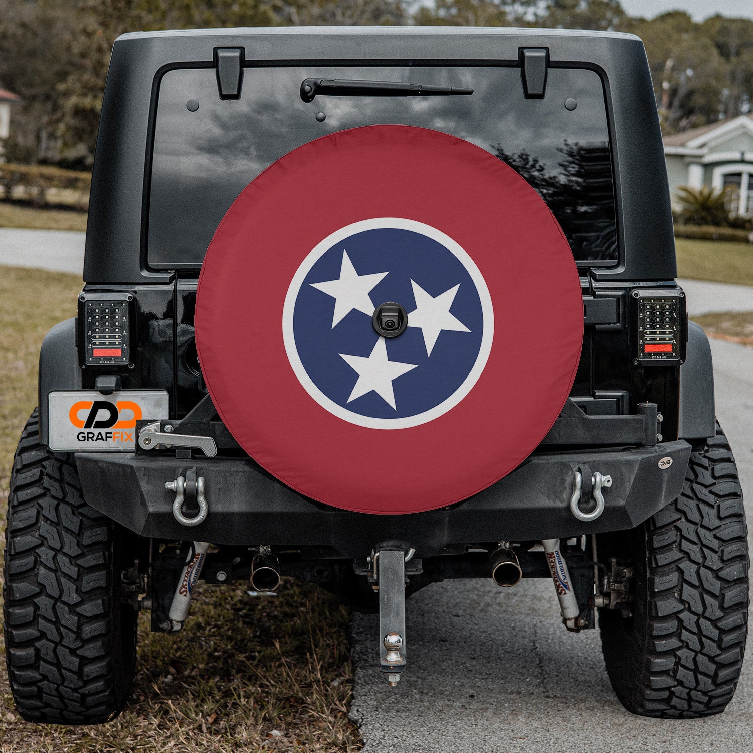a black jeep with a red, white, and blue star decal on the