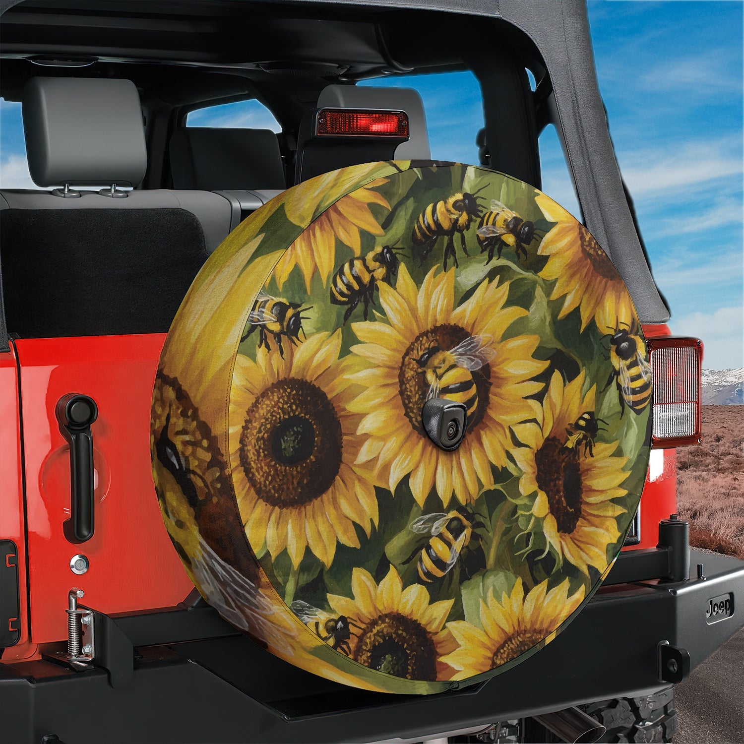 a tire cover with sunflowers and bees on it