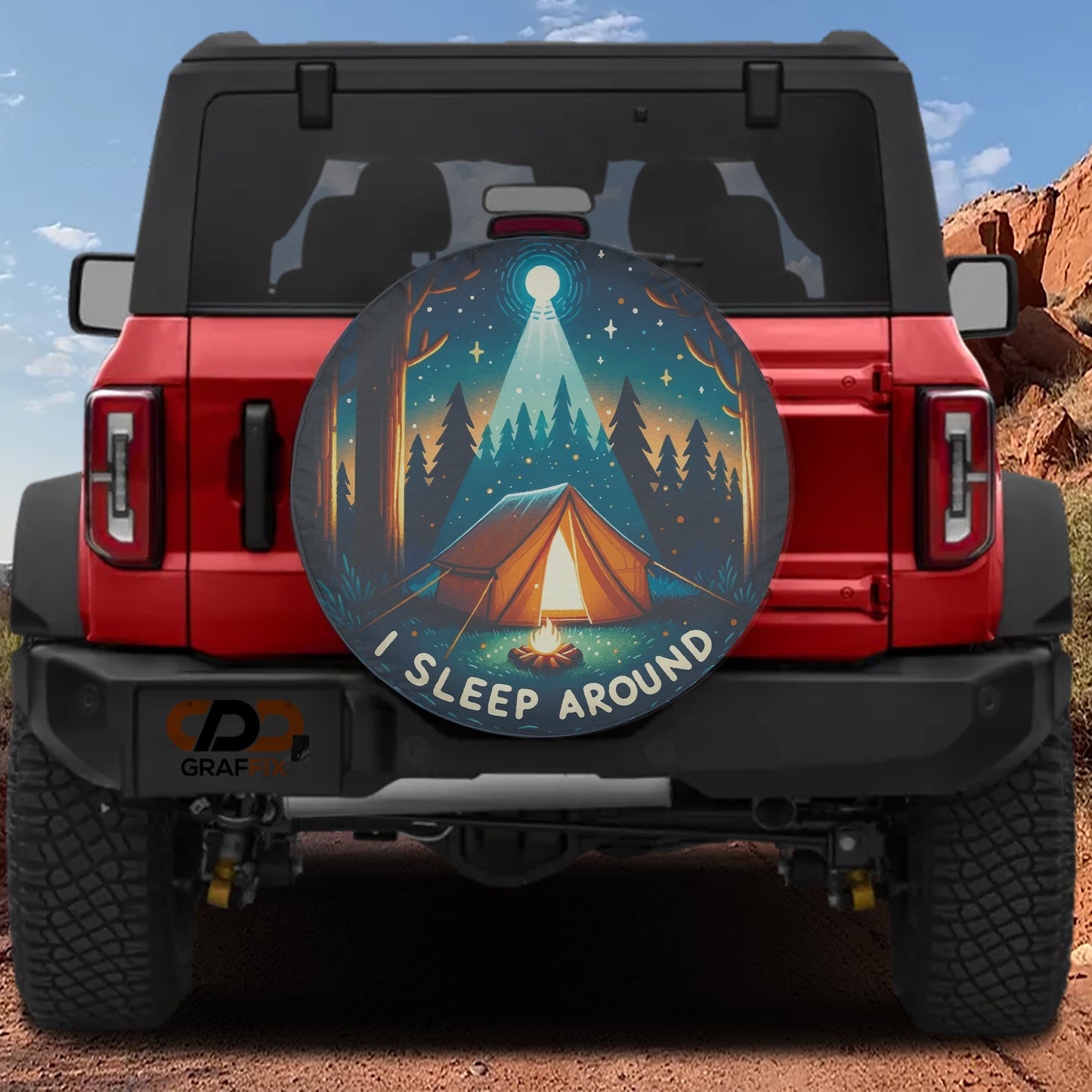 a red Jeep Wrangler with a large round decal on the rear window depicting a camping scene with a tent and campfire.