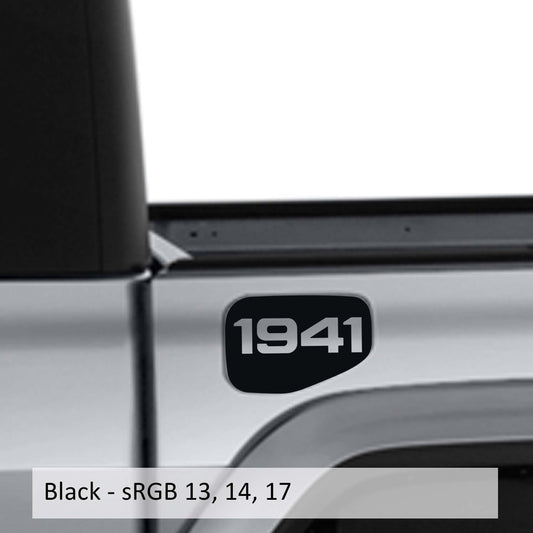 May include: A black truck bed with a black 1941 decal on the side. The truck bed is silver and the decal is in a rounded rectangle shape.